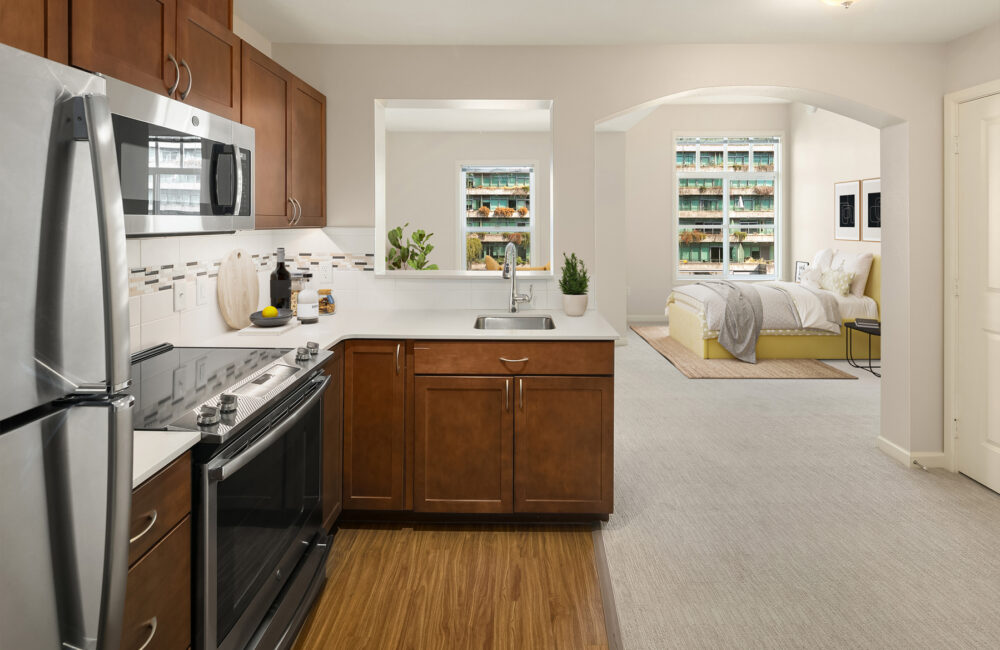 The Gardens at Town Square retirement community apartment kitchen and guest bed