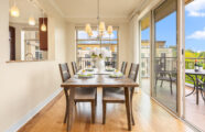 A bright dining room emphasizing indoor/outdoor leisure living at the Aljoya Mercer Island retirement community in Mercer Island.