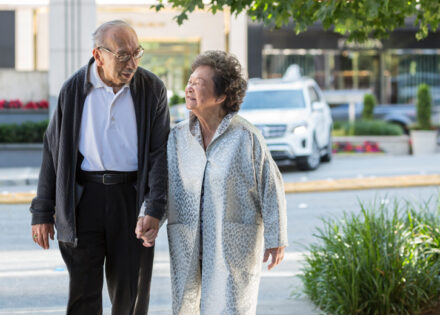 Senior couple walking down the sidewalk