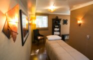 Warmly lit massage therapy room
