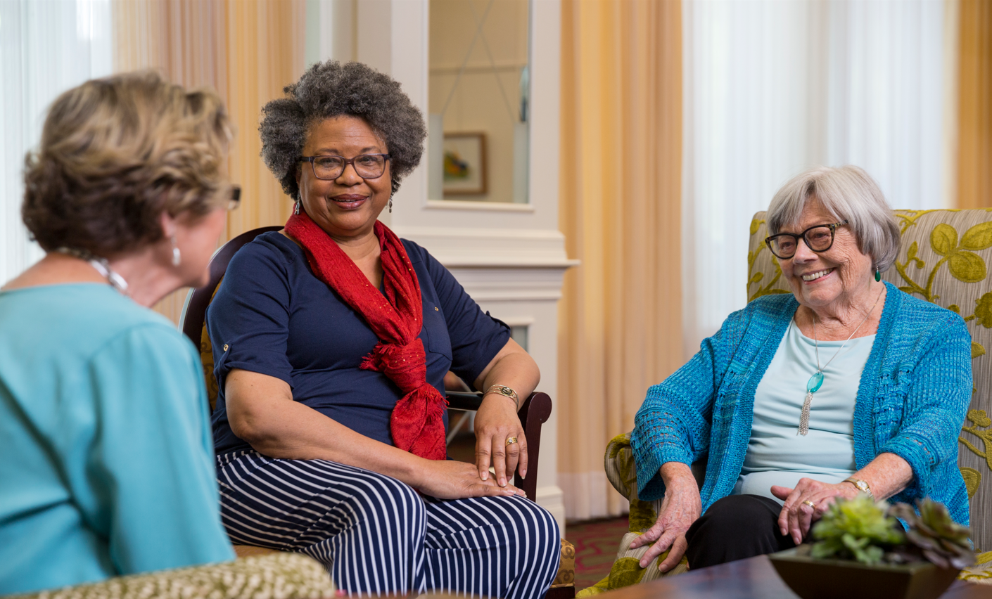 3 older ladies sitting together at The Gardens at Town Square talking