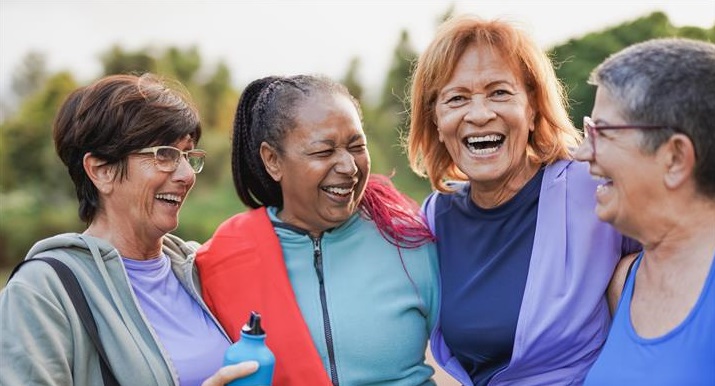 Healthy Living - Four women smiling and laughing together