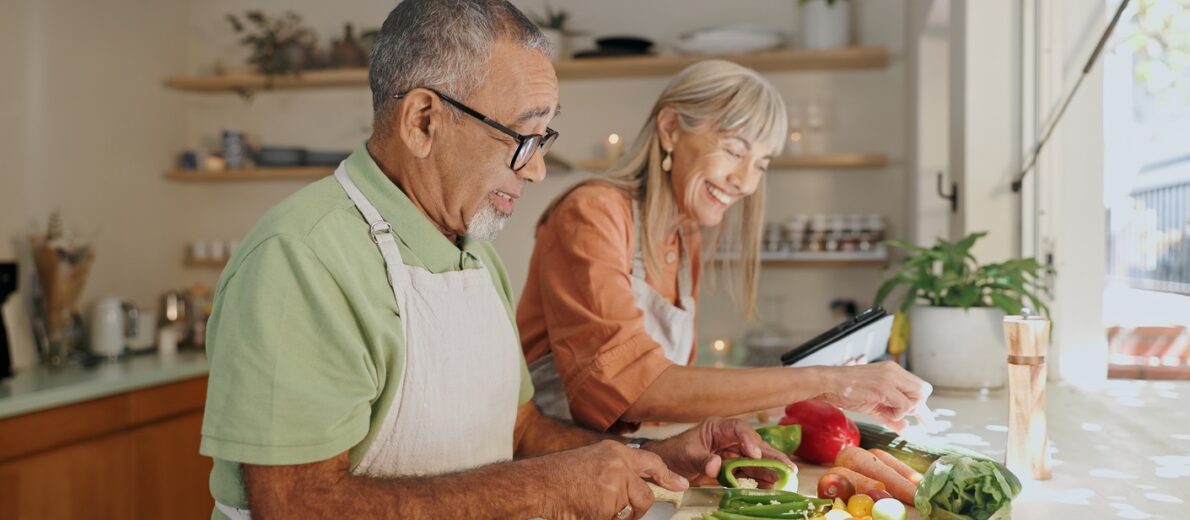 An older couple preparing a healthy meal together