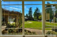 View of the cottage garden and walking paths from an apartment window.