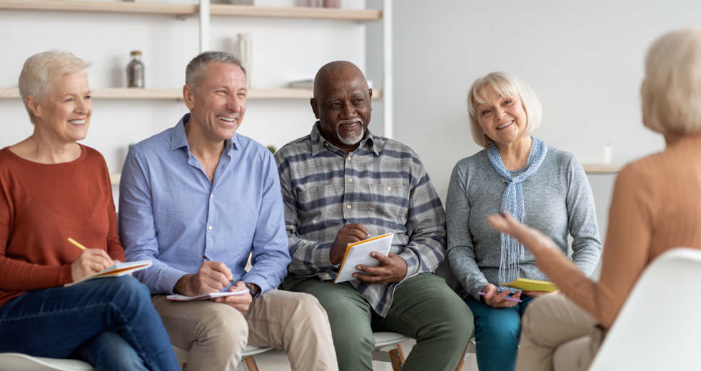 Group of older adults holding a lively discussion