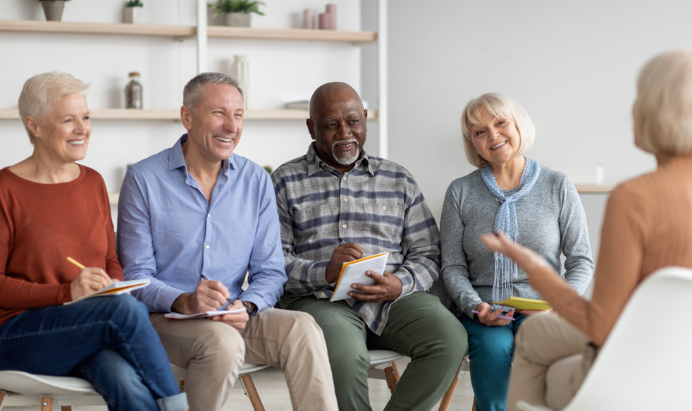 Group of older adults holding a lively discussion