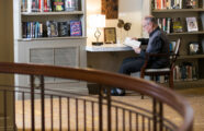 Interior shot of gentlemen enjoying library reading space in Seattle retirement living home
