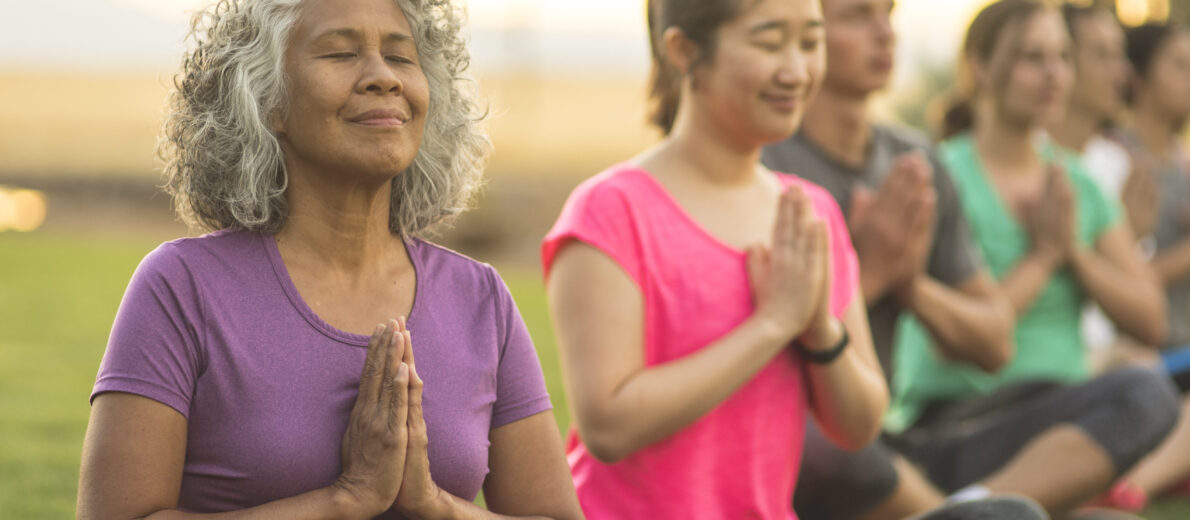 Women meditating to manage stress