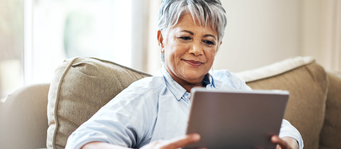 Older woman evaluating various options online